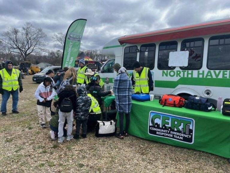 CERT Volunteers and Visitors beside ERV-111 at Touch-a-Truck 2024