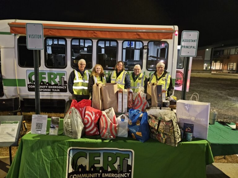 CERT Volunteers beside ERV-111 at Night