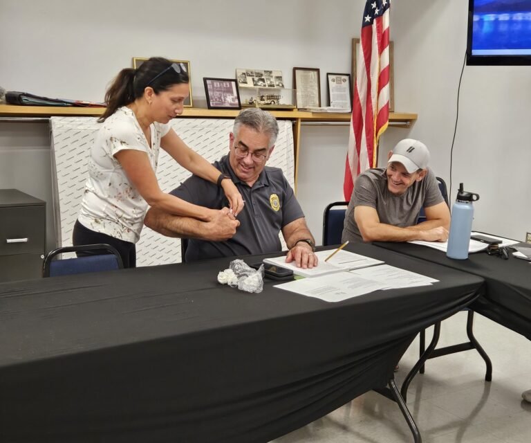 Participants Practicing First Aid at a Table