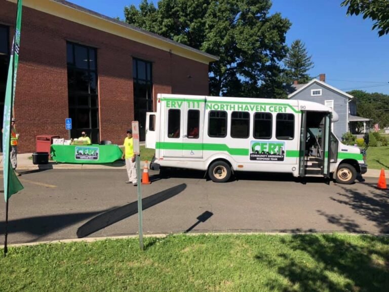 ERV-111 beside a Community Outreach Table